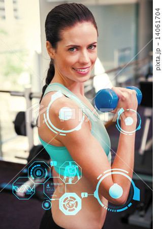 Composite image of fit brunette lifting blue dumbbell Composite image of fit brunette lifting blue dumbbell 14061704