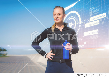 Composite image of fit blonde holding bottle on the pier Composite image of fit blonde holding bottle on the pier 14061705