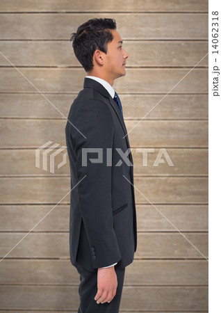 Composite image of serious young asian businessman Composite image of serious young asian businessman 14062318