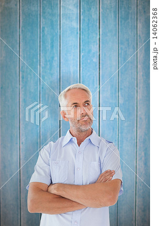 Composite image of thinking man posing with arms crossed 14062368