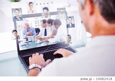 Composite image of man with grey hair typing on laptop Composite image of man with grey hair typing on laptop 14062418