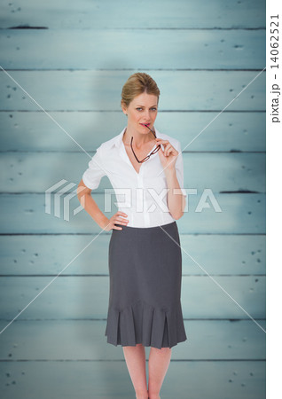 Composite image of thinking businesswoman Composite image of thinking businesswoman 14062521