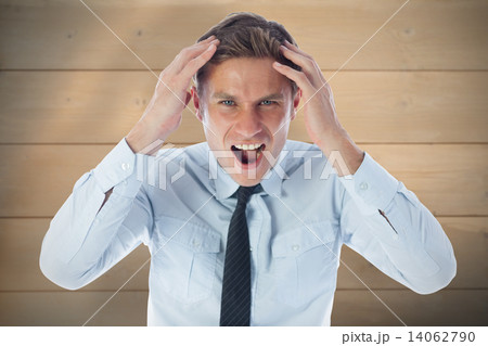 Composite image of stressed businessman shouting Composite image of stressed businessman shouting 14062790