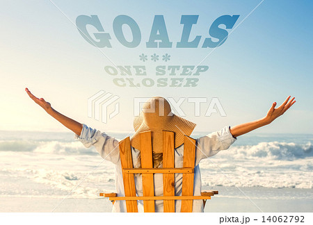 Composite image of woman relaxing in deck chair by the sea Composite image of woman relaxing in deck chair by the sea 14062792