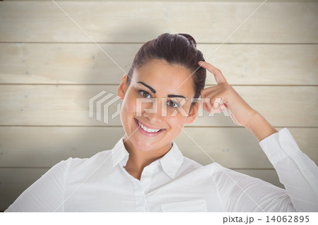 Composite image of smiling thoughtful businesswoman Composite image of smiling thoughtful businesswoman 14062895
