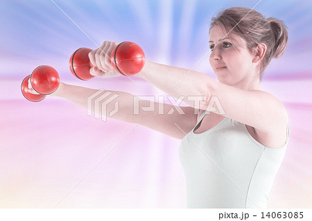Composite image of woman holding weights 14063085