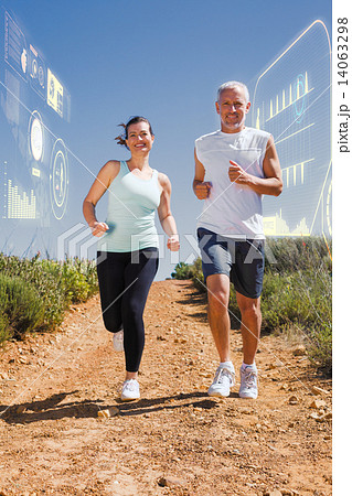 Composite image of fit couple running down mountain trail 14063298