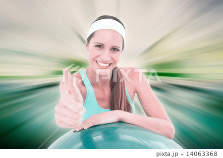 Composite image of smiling fit woman with fitness ball gesturing 14063368