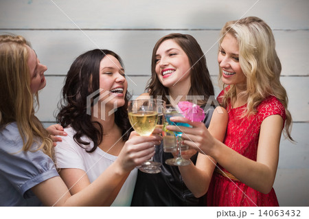 Composite image of friends with drinks Composite image of friends with drinks 14063432