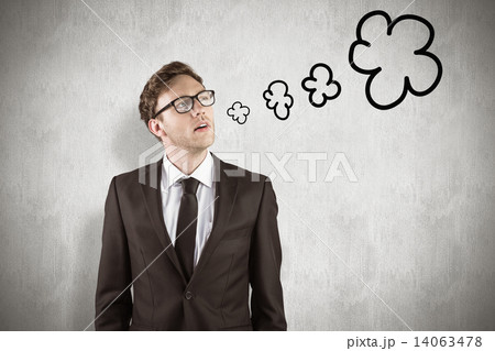 Composite image of young businessman thinking and looking up Composite image of young businessman thinking and looking up 14063478