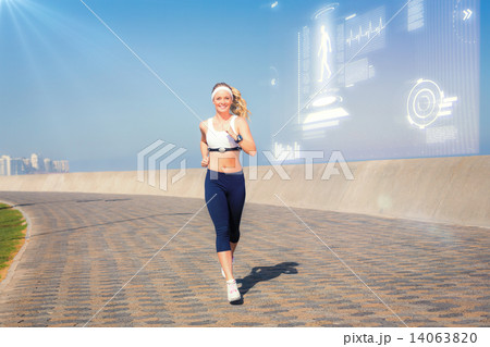 Composite image of fit blonde jogging on the pier 14063820