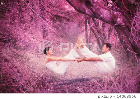 Composite image of peaceful couple sitting in boat position toge Composite image of peaceful couple sitting in boat position toge 14063956