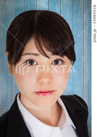 Composite image of serious businesswoman Composite image of serious businesswoman 14064316