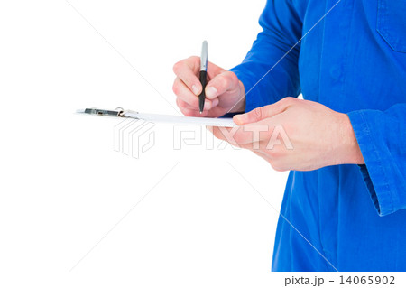 Mechanic writing on clipboard 14065902