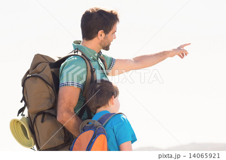 Father and son hiking through mountains 14065921