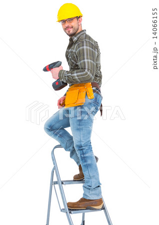 Repairman with drill machine climbing ladder 14066155