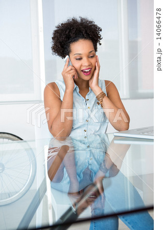 Young casual woman using cellphone 14066478