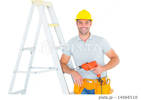 Happy handyman with power drill leaning on ladder Happy handyman with power drill leaning on ladder 14066510
