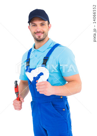 Handsome male plumber holding sink pipe 14066552