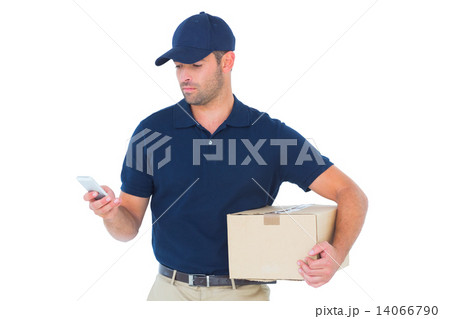 Delivery man using mobile phone while holding package 14066790