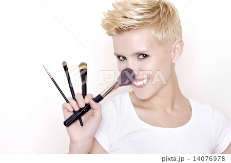 Make-up artist holding brushes 14076978
