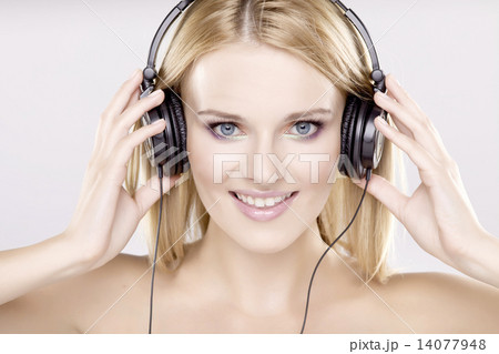 Beautiful girl is listen to the music 14077948