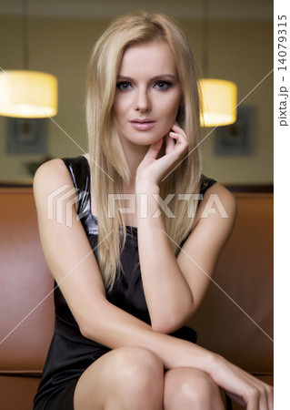 blond woman in black dress 14079315