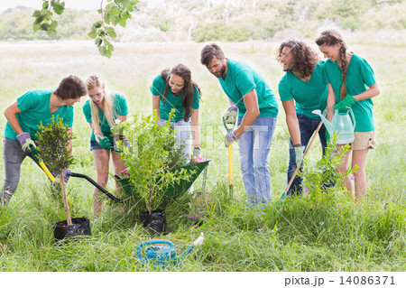 Happy friends gardening for the community 14086371