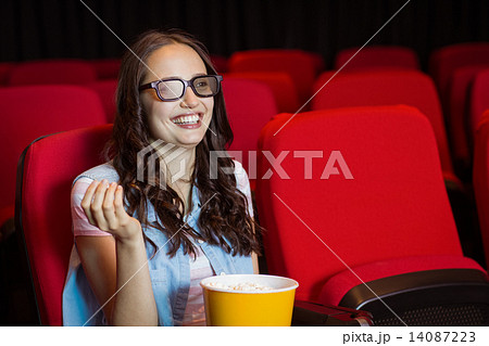 Young woman watching a 3d film Young woman watching a 3d film 14087223