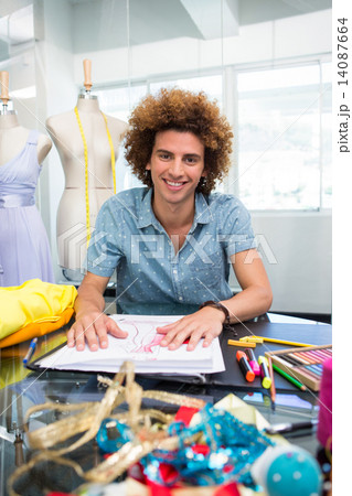 Attractive male fashion designer sketching 14087664