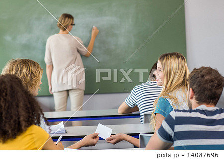 Teacher teaching students in class Teacher teaching students in class 14087696