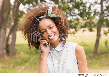 Happy young woman using smartphone Happy young woman using smartphone 14087724