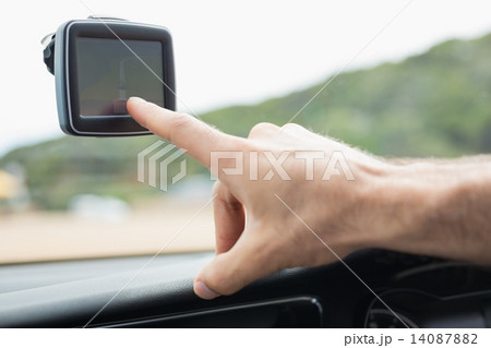 Man using satellite navigation system Man using satellite navigation system 14087882