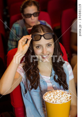 Young friends watching a 3d film Young friends watching a 3d film 14088119