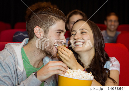 Young couple watching a film Young couple watching a film 14088644