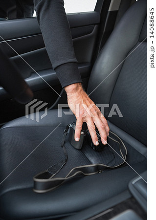 Thief breaking into car and stealing Thief breaking into car and stealing 14088645