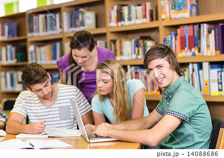 College students doing homework in library College students doing homework in library 14088686