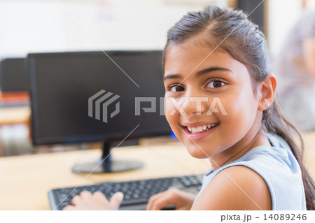 Cute pupil in computer class Cute pupil in computer class 14089246