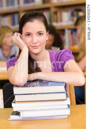 Portrait of female student in library Portrait of female student in library 14090074