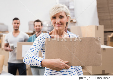 Smiling volunteer showing a poster Smiling volunteer showing a poster 14091692