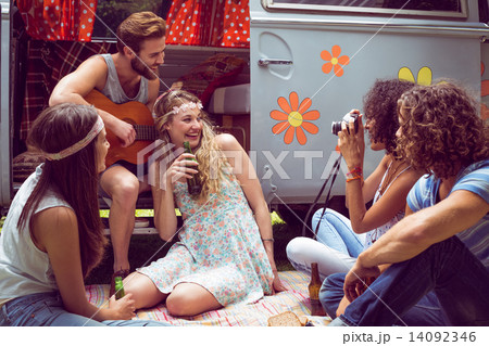 Hipster friends by camper van at festival 14092346