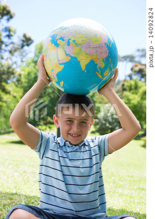 Little boy holding a globe 14092824