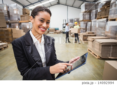 Smiling manager using digital tablet 14092994