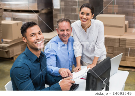 Warehouse team smiling at camera Warehouse team smiling at camera 14093549