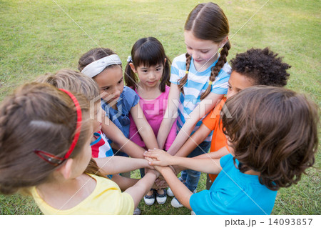 Little children putting hands together Little children putting hands together 14093857