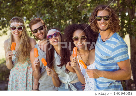Hipster friends enjoying ice lollies 14094003