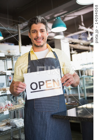 Attractive worker holding open sign 14094068