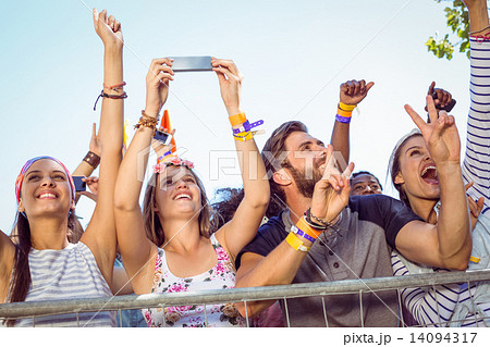 Excited music fans up the front Excited music fans up the front 14094317