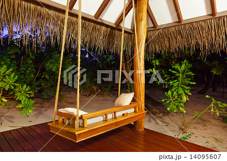 Beach bungalow at sunset - Maldives 14095607