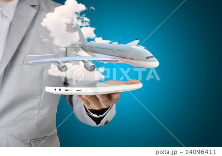Business man holding tablet present airplane in his hand 14096411